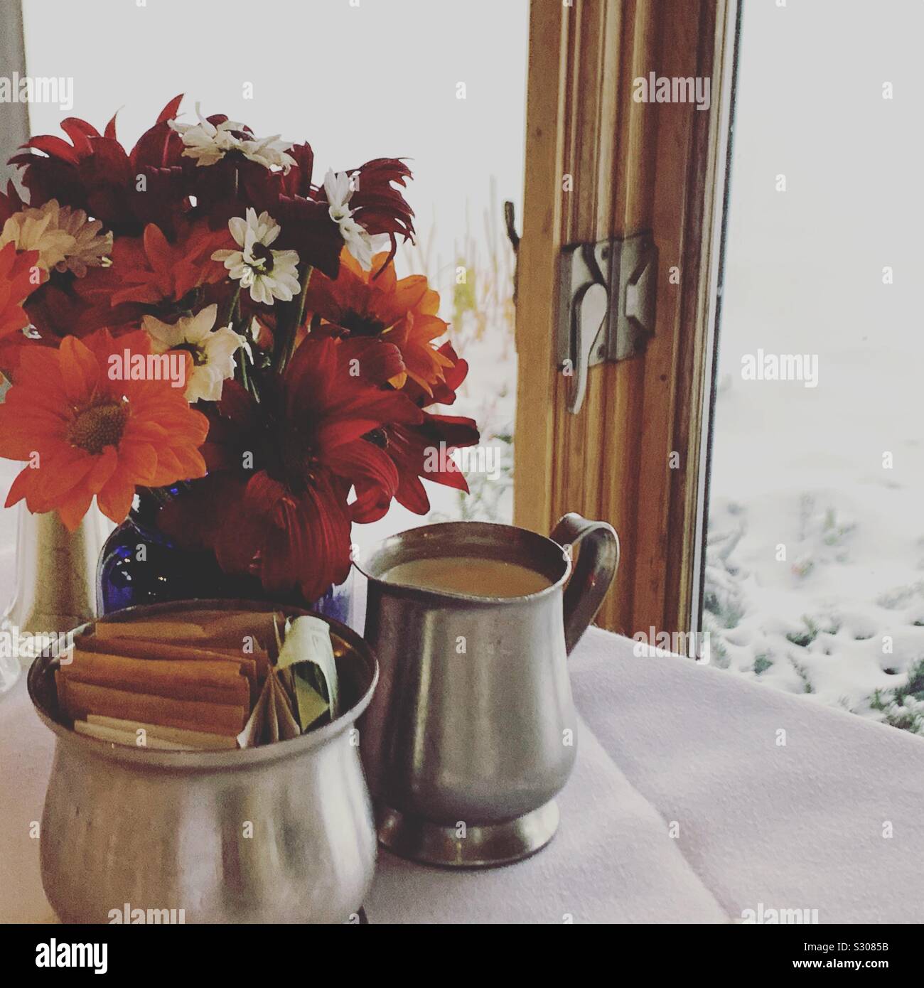 Breakfast table overlooking snow outside, Dining Room, Trapp Family Lodge, Stowe, Vermont, United States - Smartphone Captured Stock Image