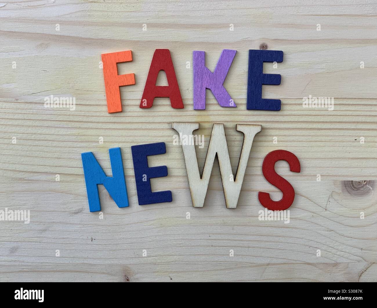 Fale News text composed with colored wooden letters - Smartphone Captured Stock Image