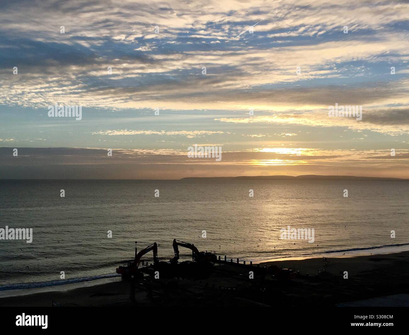Sunset over Groyne Repairs at Southbourne Beach, Bournemouth, Dorset Stock Photo