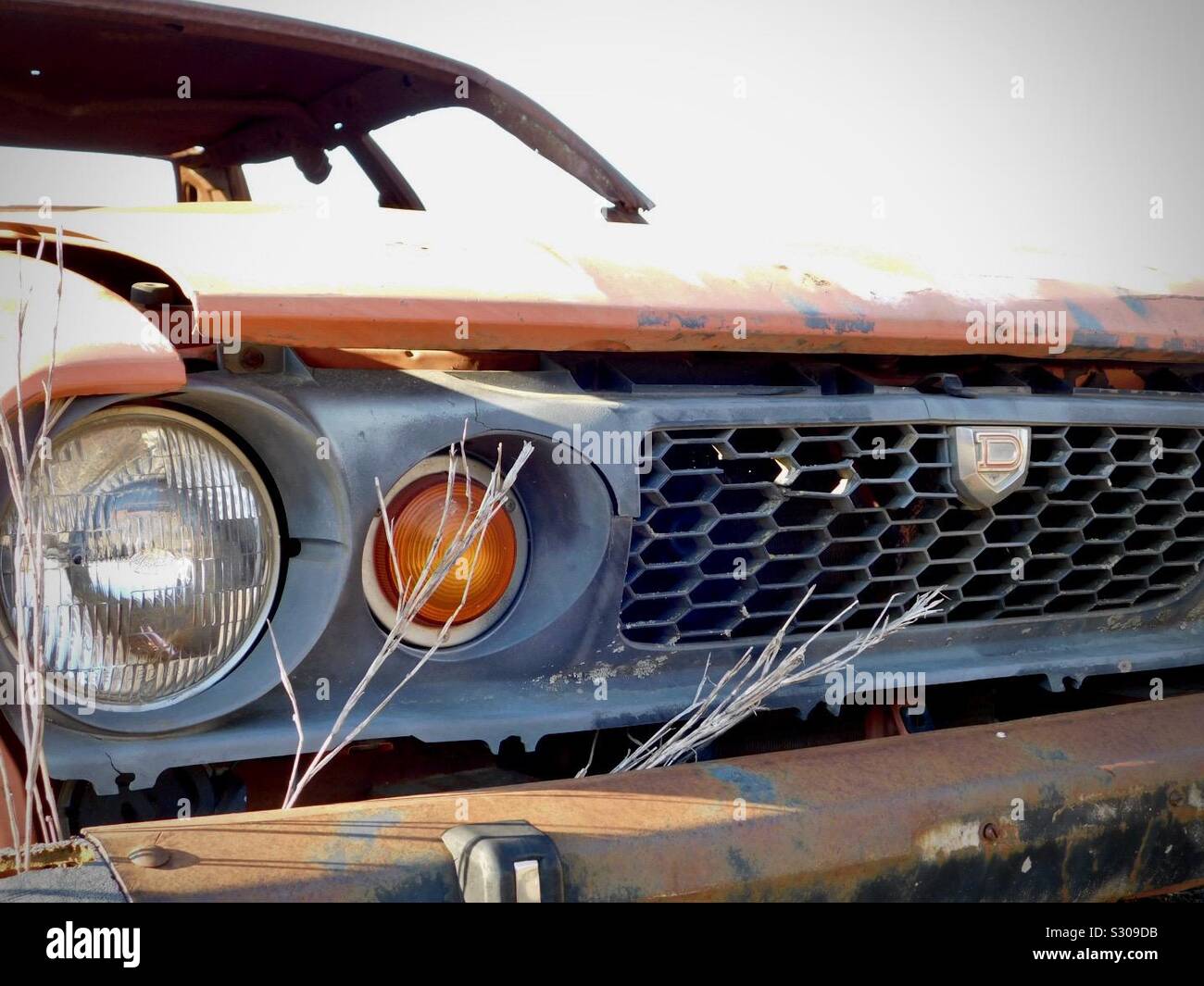 Front end of old Datsun car after being used for fire academy practice. Stock Photo
