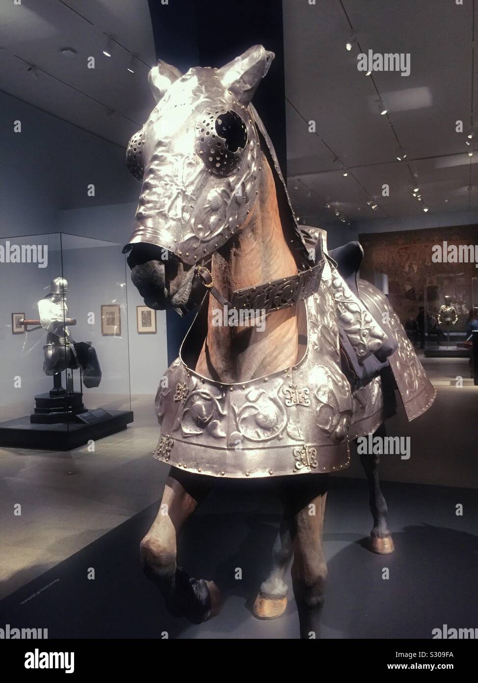 Armor on a horse at the Maximilian one exhibit at the Metropolitan Museum of art, NYC, USA - Smartphone Captured Stock Image
