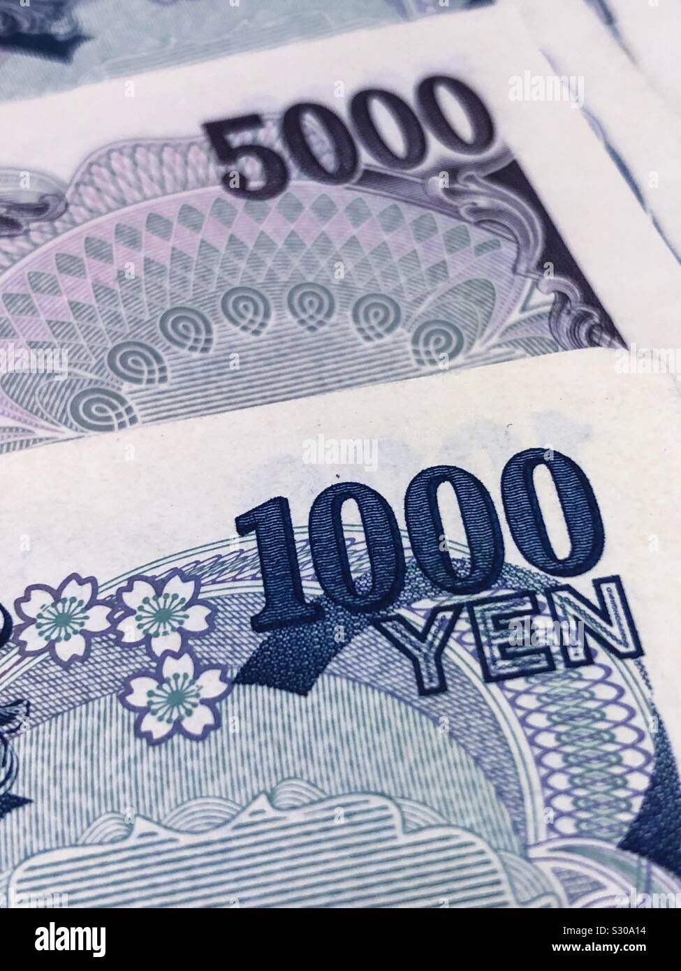 Closeup of some Japanese bank notes, the Japanese currency is called the Yen Stock Photo Alamy