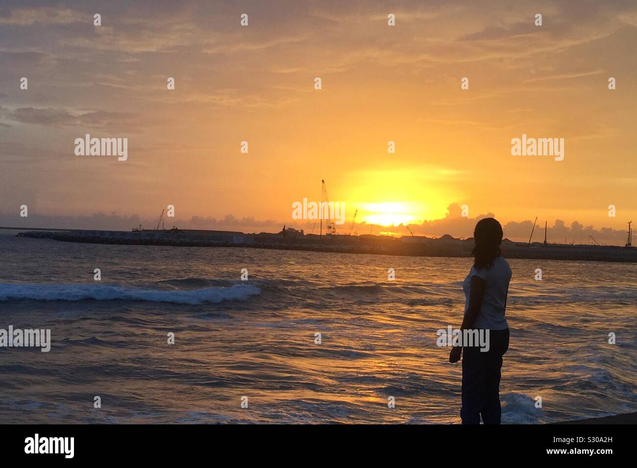 Beach waves sunset hi-res stock photography and images - Alamy