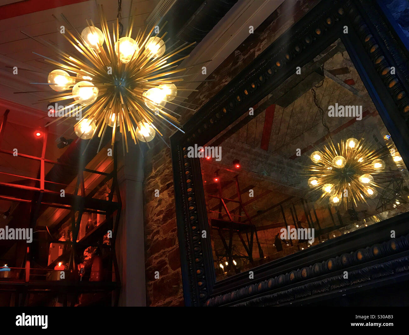 Modern lighting and reflection in mirror at Isaacs bar in Cork Ireland - Smartphone Captured Stock Image