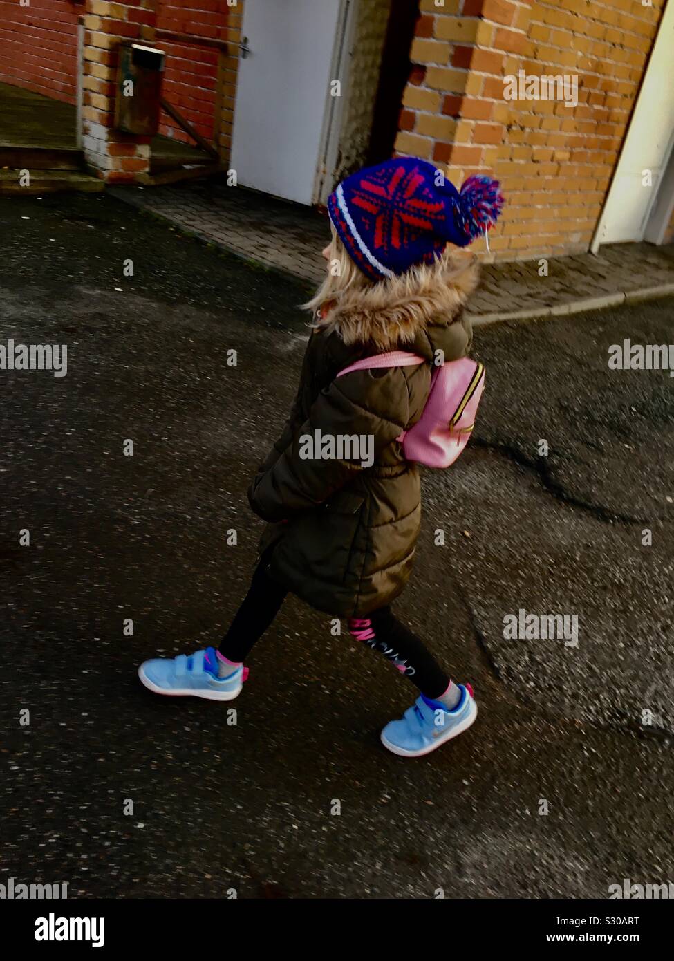 Girl walking in ghetto - Smartphone Captured Stock Image