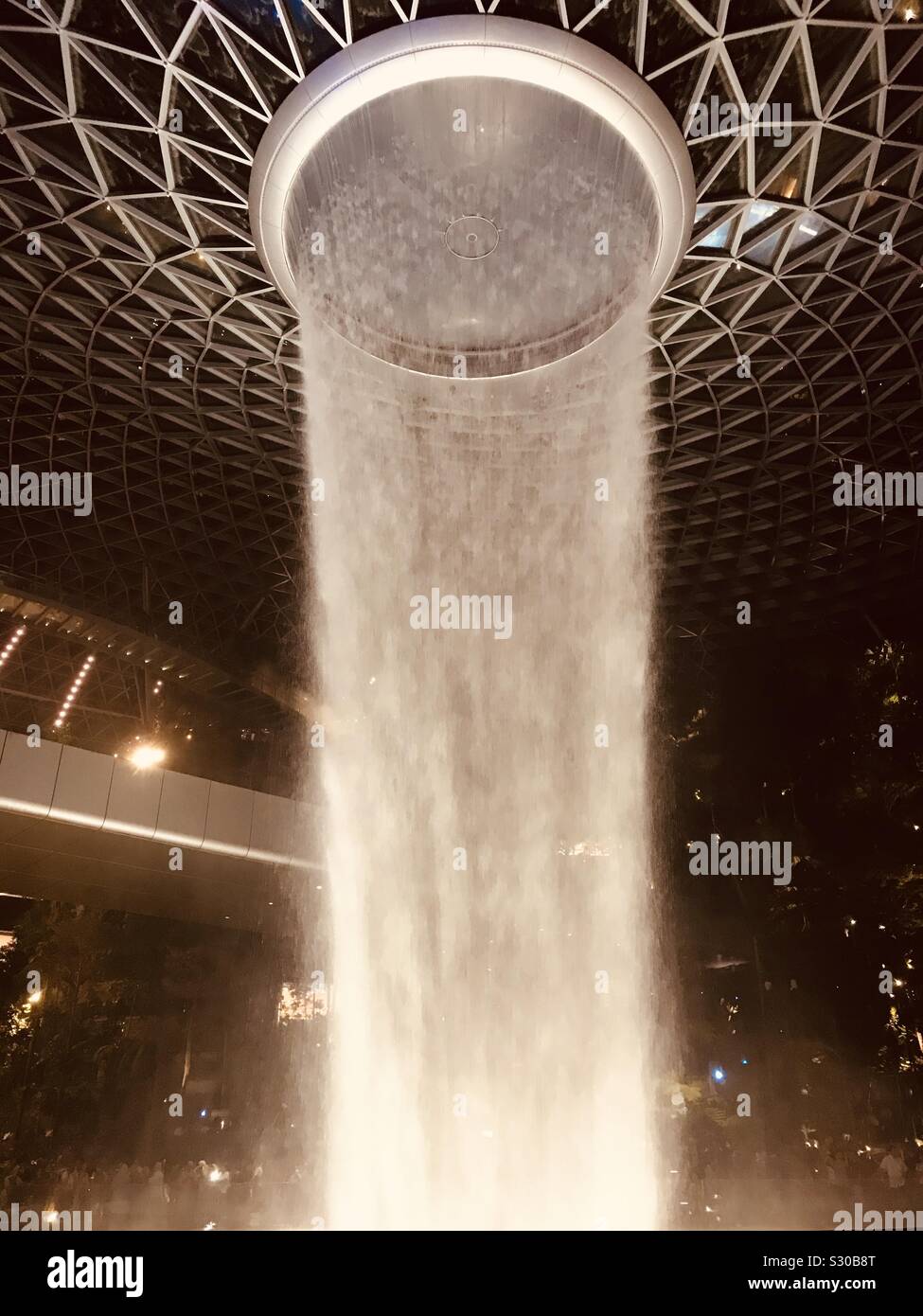 HSBC rain Vortex in Singapore Jewel Changi Airport- water gushing from 7 storey height Stock Photo