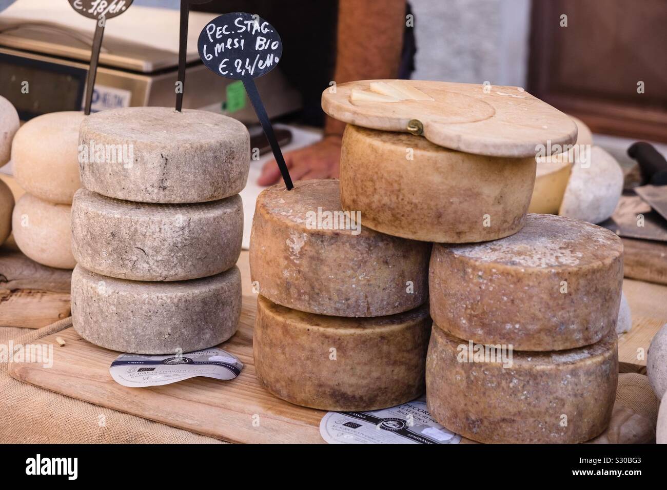 Pecorino cheeses for sale on a market stall in Tuscany Stock Photo Alamy