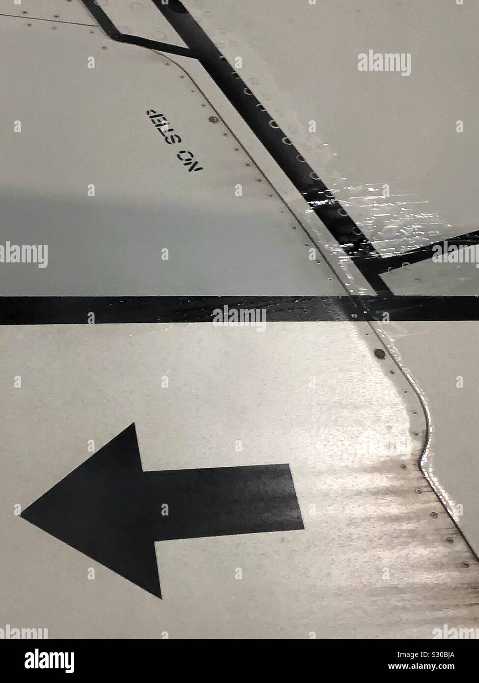 Walk this way: Closeup of top surface of a wing of a Boeing 737-800. - Smartphone Captured Stock Image