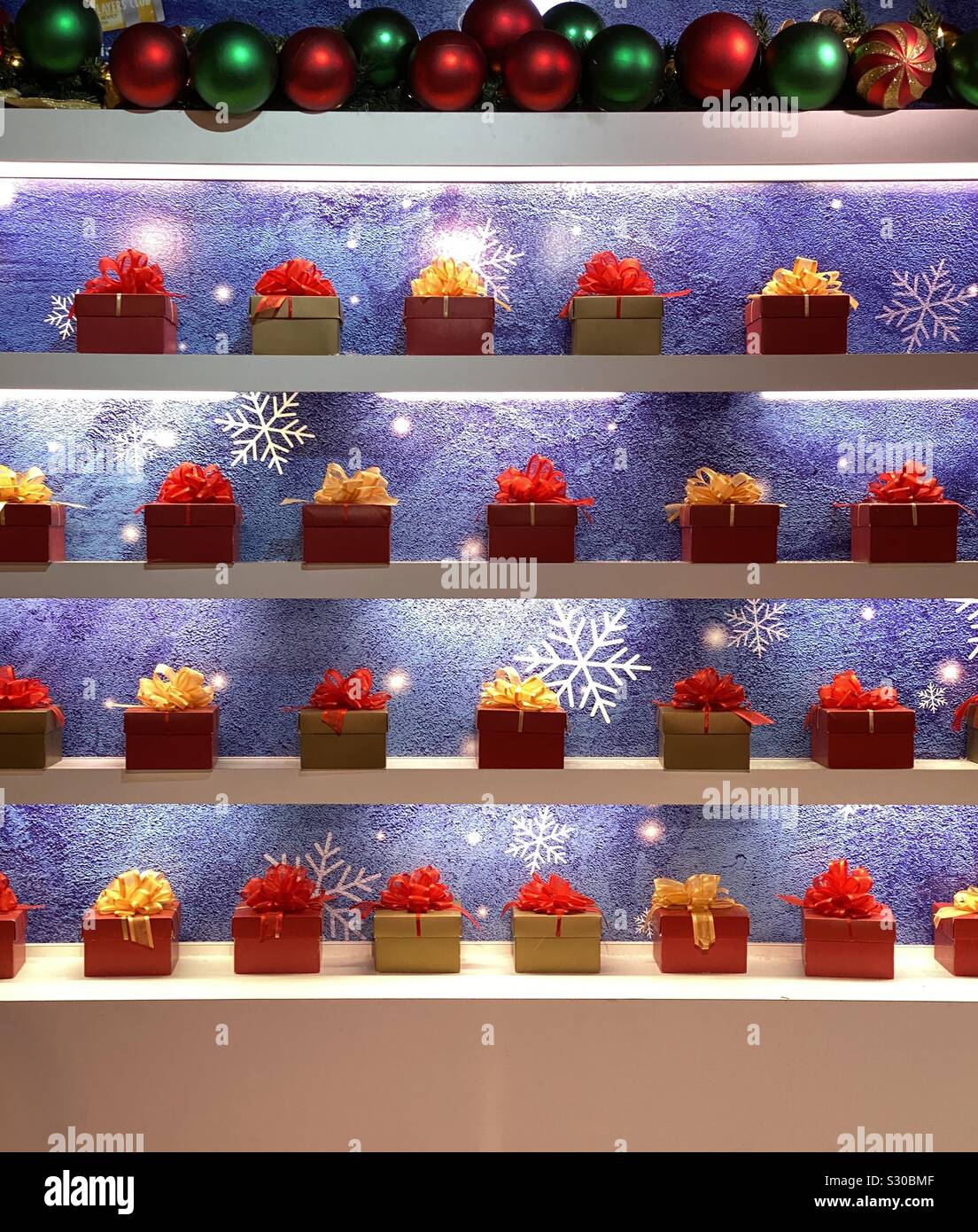 Display of colorful Christmas boxes with bows - Smartphone Captured Stock Image