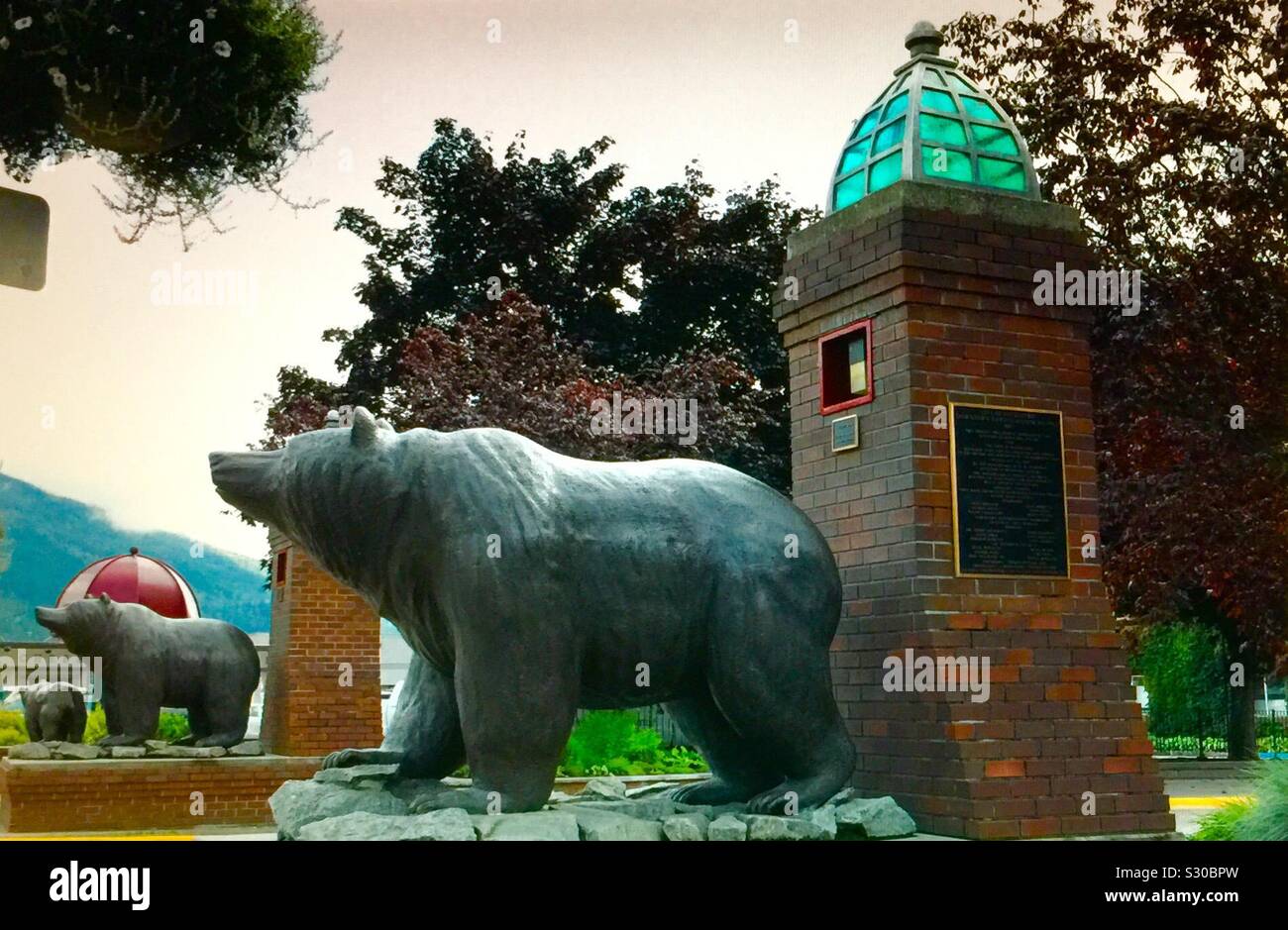 Grizzly bear sculpture, street photography, city of Revelstoke, British Columbia, Canada - Smartphone Captured Stock Image
