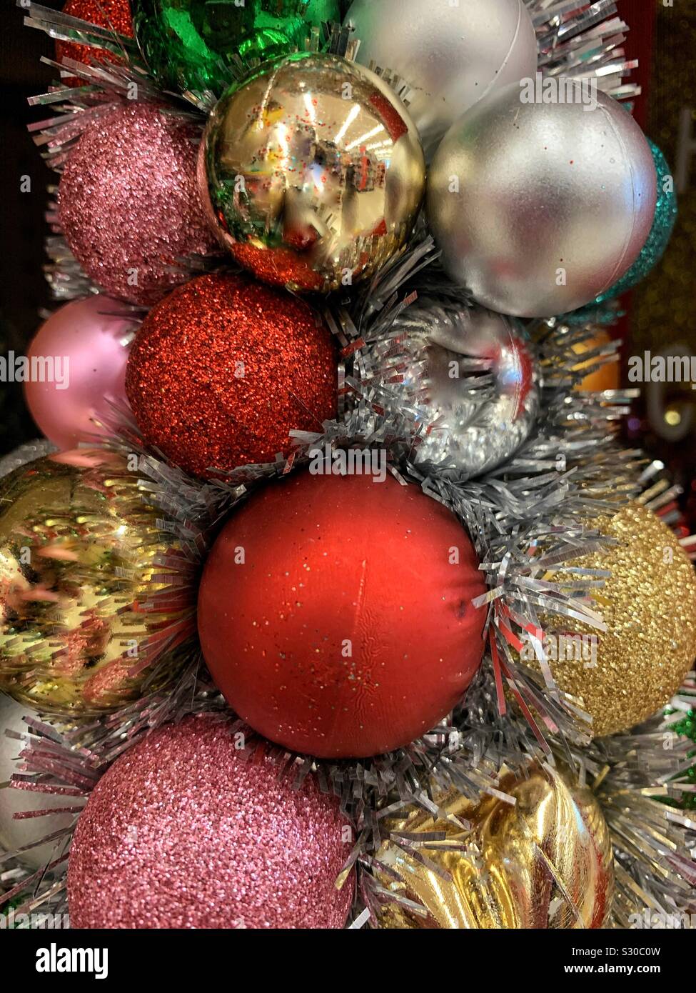 Christmas baubles hanging on a pine tree - Smartphone Captured Stock Image