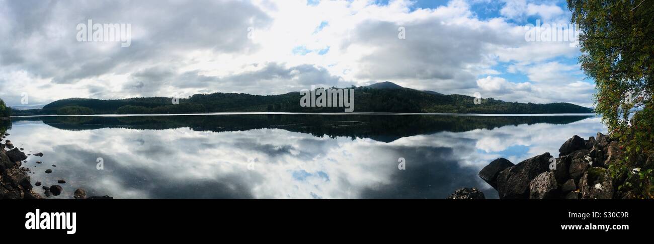 Panoramic view of Reflections in Loch Garry, Near Invergarry, Scotland, from the shore Stock Photo