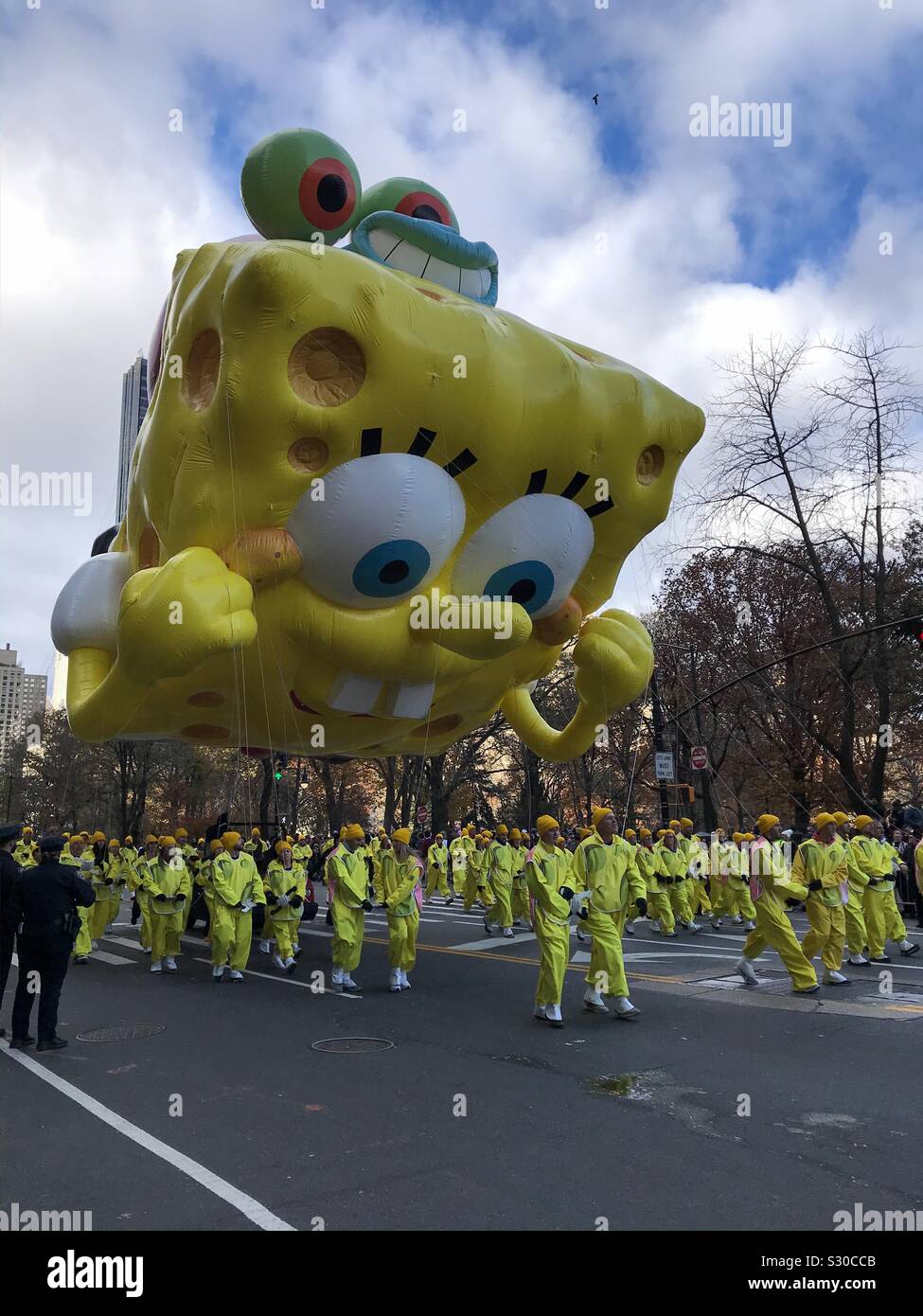 NYC, NY, USA- November 28, 2019. Sponge Bob Square Pants balloon flies in the Macy’s Thanksgiving Day Parade. - Smartphone Captured Stock Image
