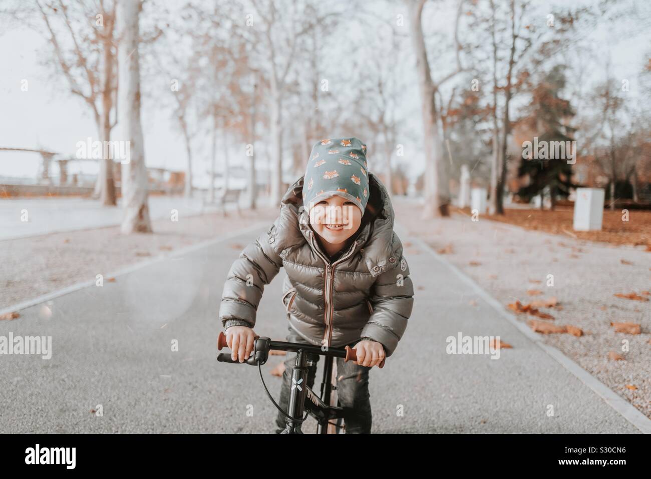 Happy Kid on the bike Stock Photo