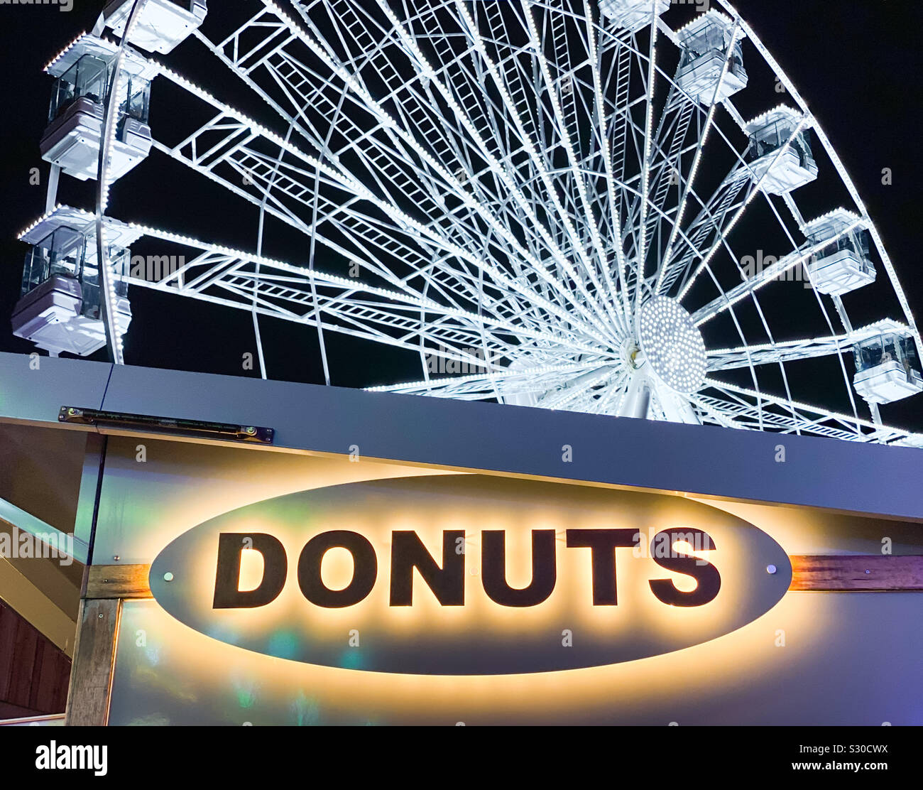 Sign on a donuts stall at a winter fair Stock Photo
