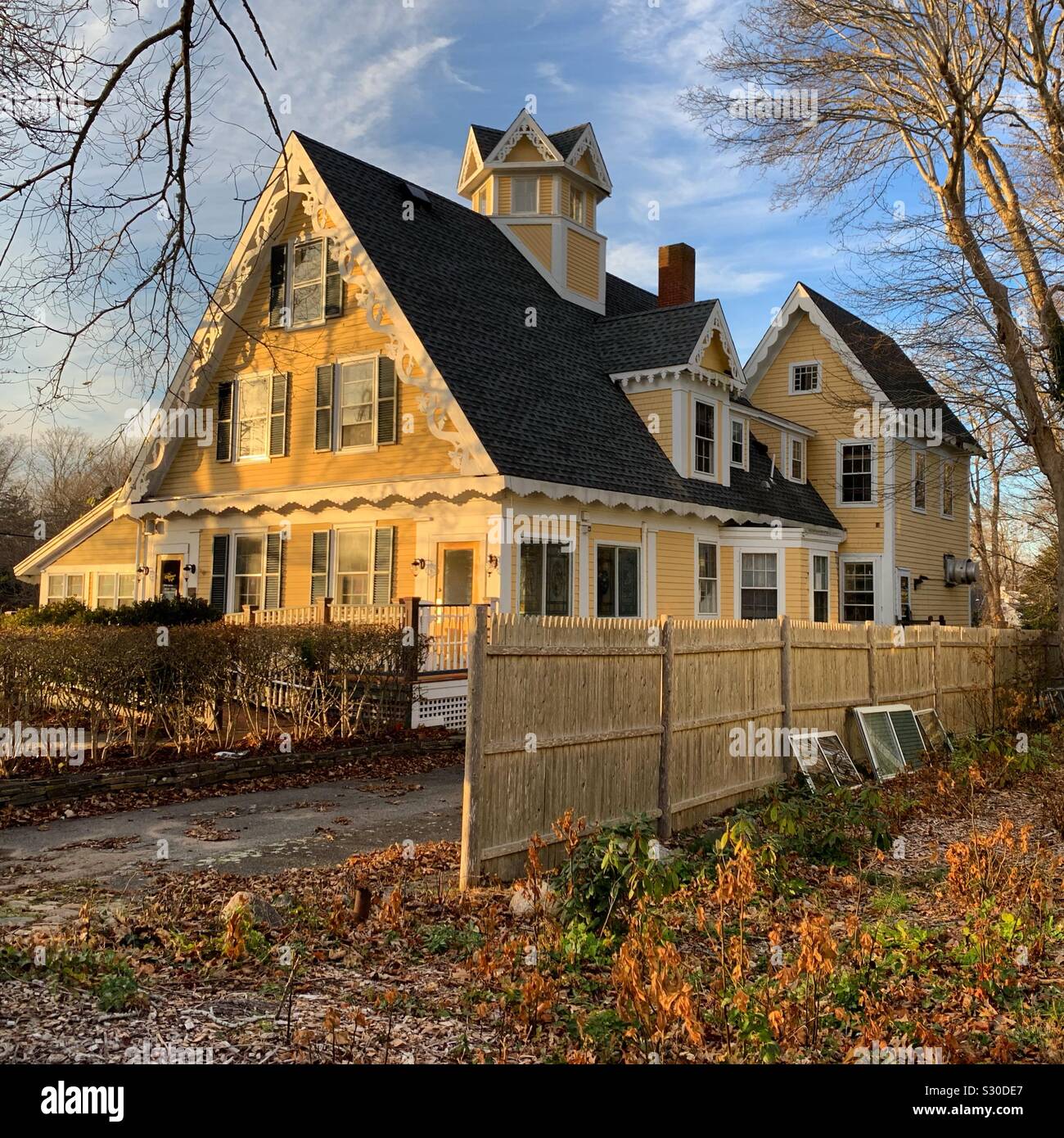 A fall view of the Optimist Cafe, Yarmouth Port, Cape Cod, Massachusetts, United States. The Cafe is housed in the Captain Howes House, built for a sea captain in the Gothic Revival style in 1849. - Smartphone Captured Stock Image A fall view of the Optimist Cafe, Yarmouth Port, Cape Cod, Massachusetts, United States. The Cafe is housed in the Captain Howes House, built for a sea captain in the Gothic Revival style in 1849. - Smartphone Captured Stock Image
