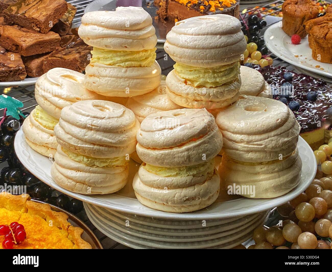 Plate of meringues filled with fresh cream - Smartphone Captured Stock Image