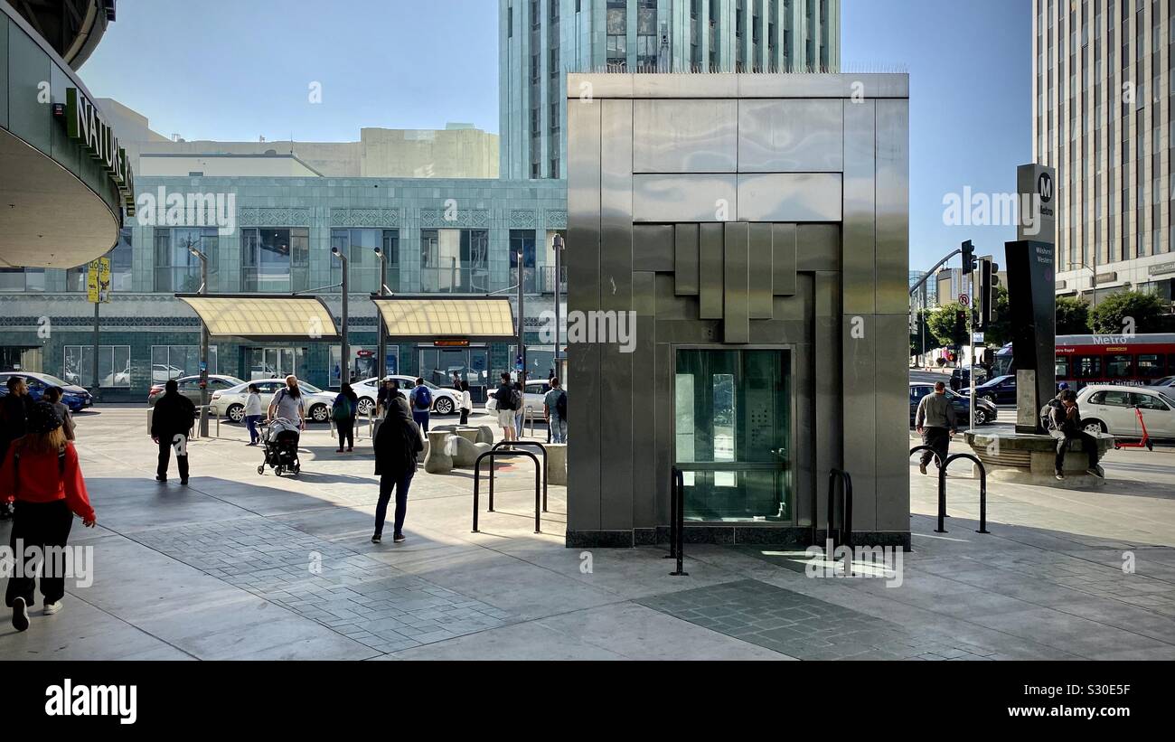 LOS ANGELES, CA, NOV 2019: pedestrians and traffic at the intersection of Wilshire and Western, by the LA Metro Purple Line Station elevator entrance - Smartphone Captured Stock Image