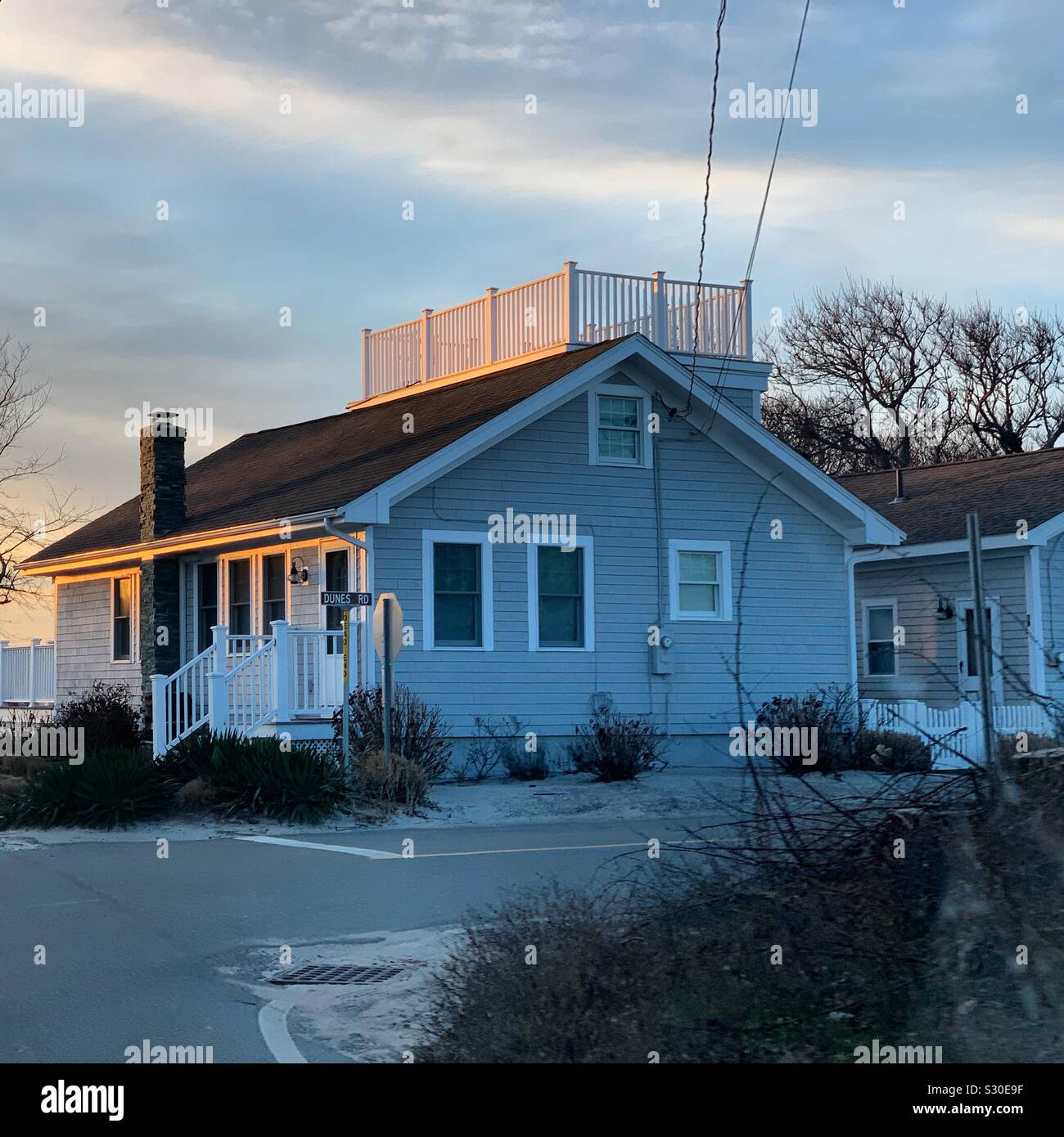 A late afternoon November view of a home near Mayflower Beach, Dennis, Cape Cod, Massachusetts, United States - Smartphone Captured Stock Image