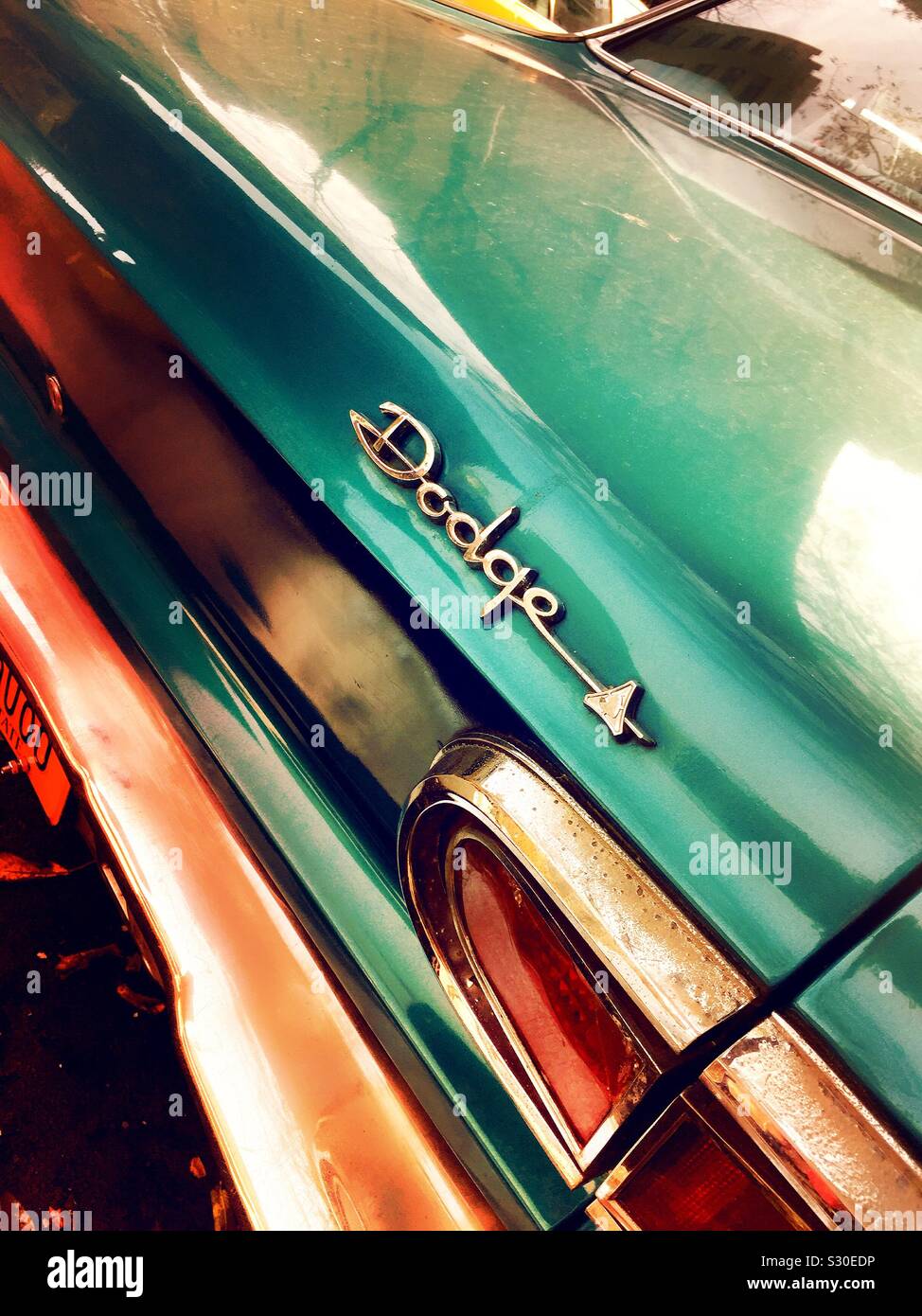 Tail lights and rear trunk panel of a vintage 1960s dodge automobile ...