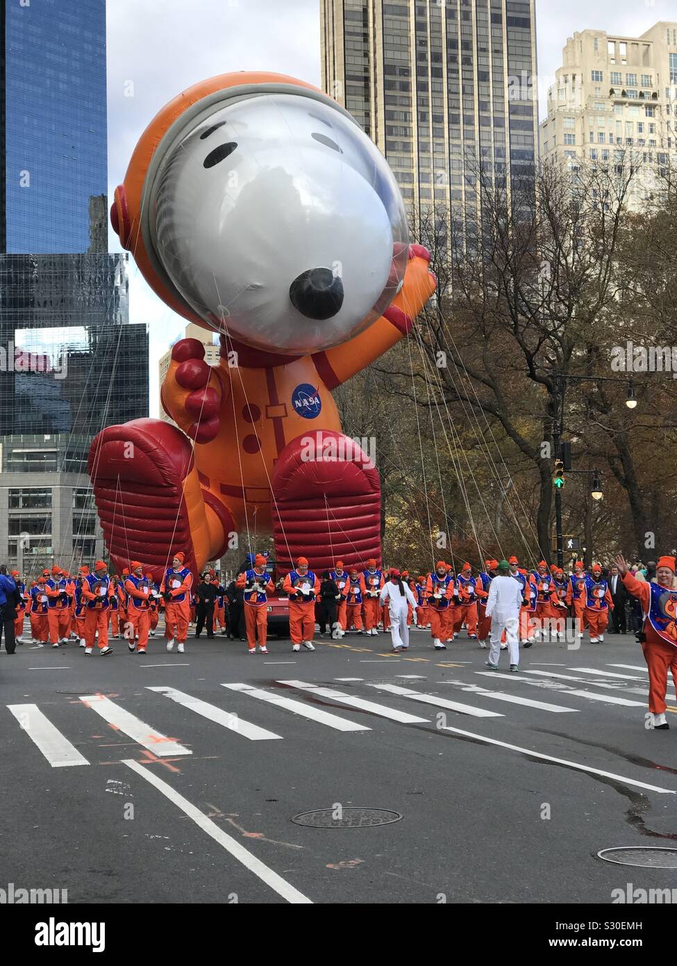 New York City, NY, USA- November 28, 2019. Astronaut Snoopy debuts in the 93 annual Macy’s Thanksgiving Day Parade. - Smartphone Captured Stock Image