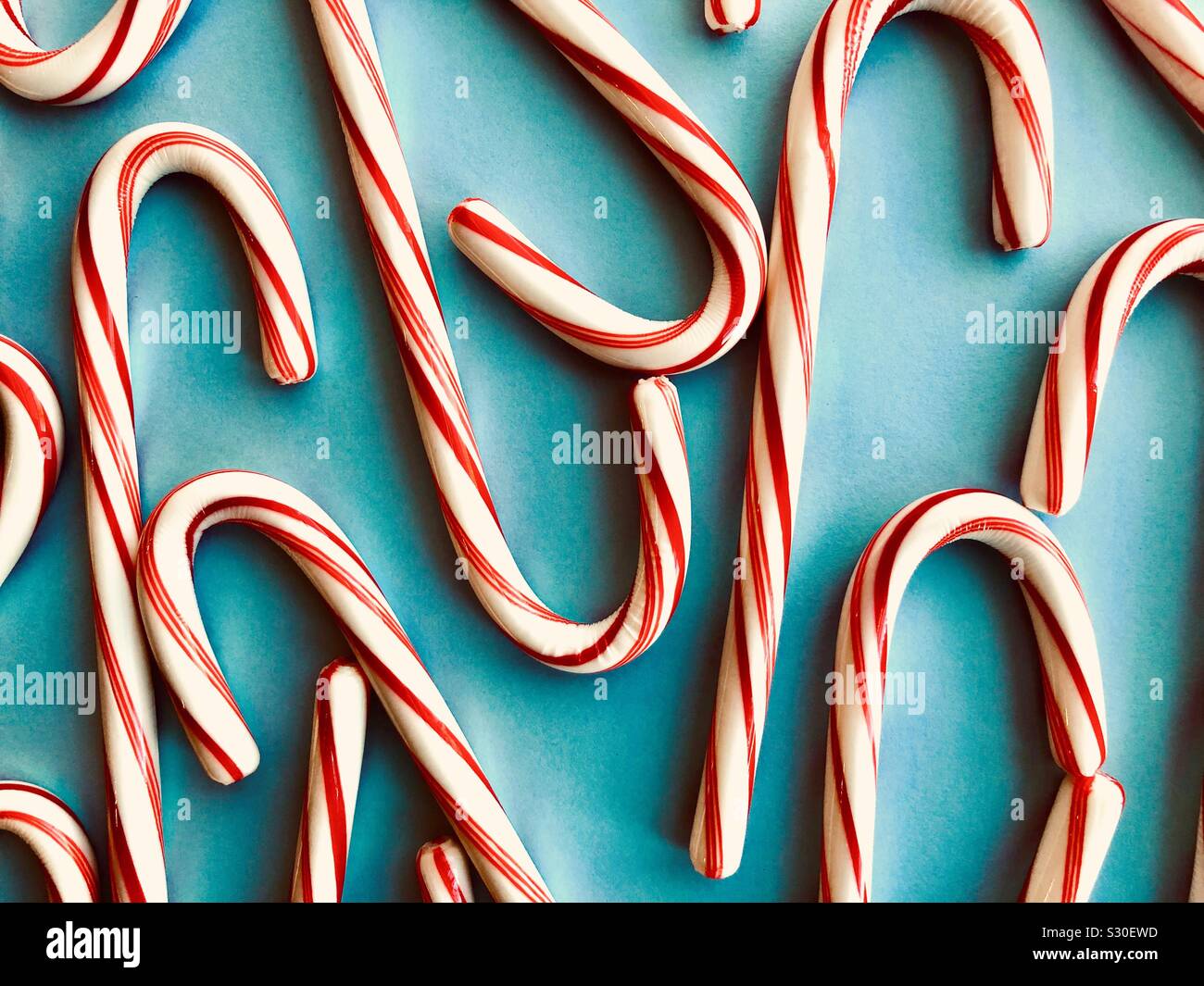 Candy canes on a blue background - Smartphone Captured Stock Image