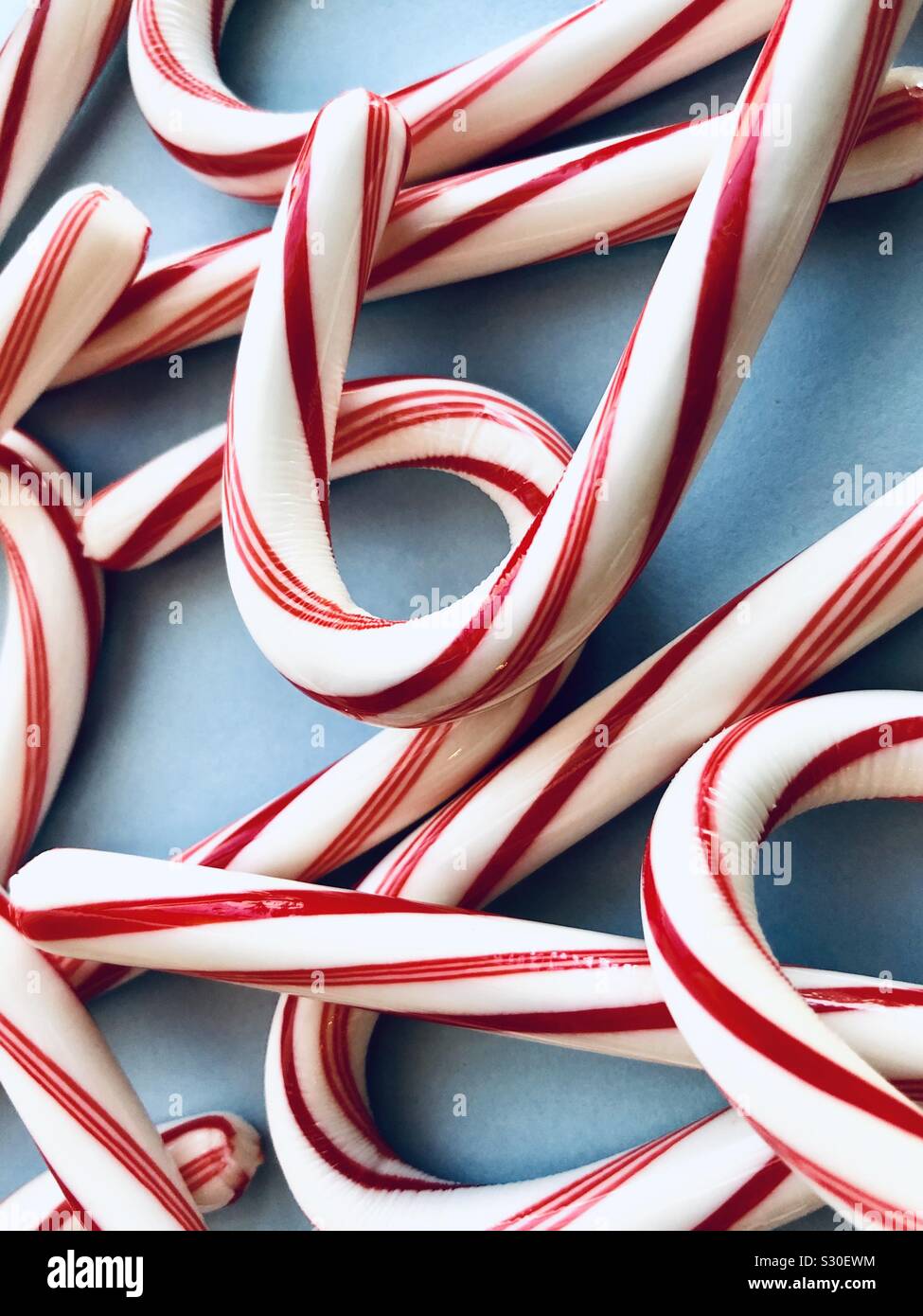 Candy canes on a blue background - Smartphone Captured Stock Image