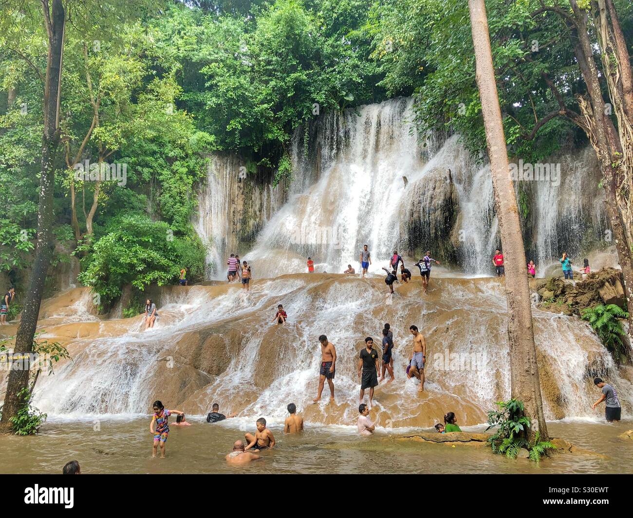 Outdoor activity by the waterfall. - Smartphone Captured Stock Image