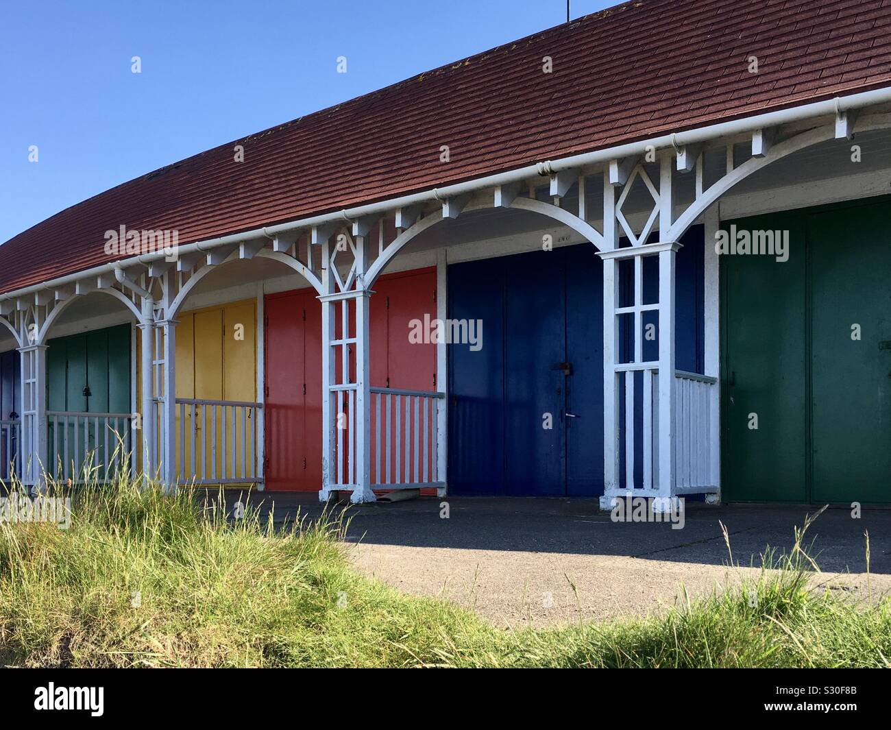 Beach huts and chalets with coloured doors at Scarborough, Yorkshire - Smartphone Captured Stock Image