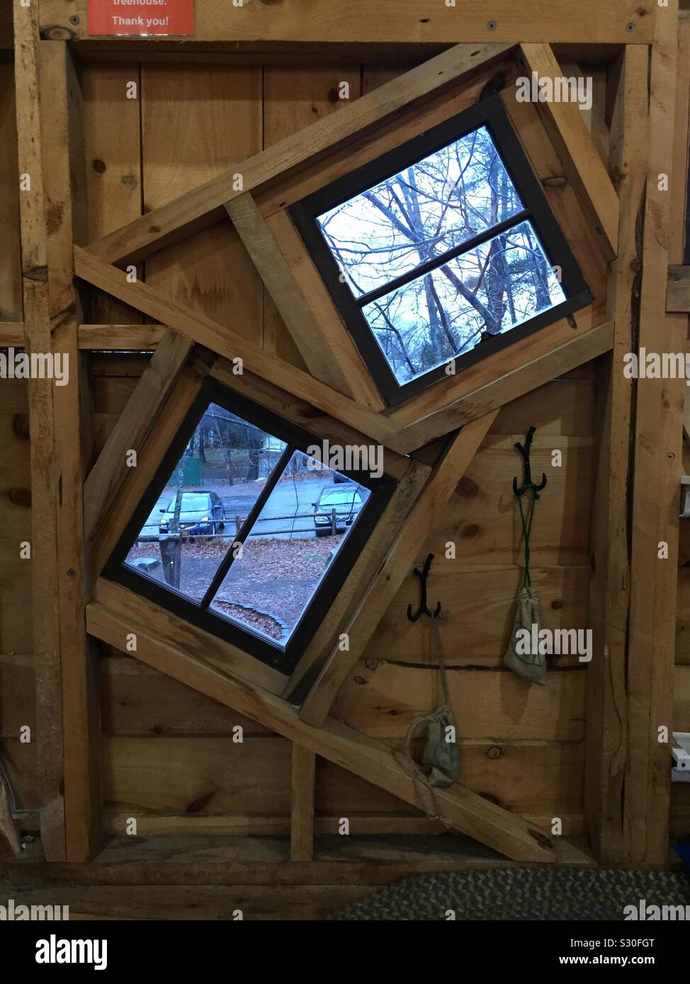 Angled windows at professionally built tree house in Massachusetts. - Smartphone Captured Stock Image