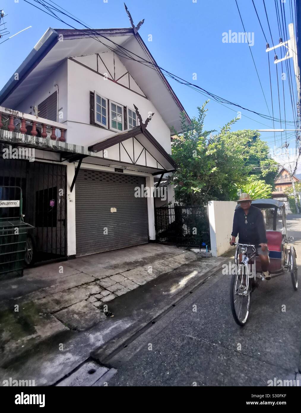 A cycle rickshaw in the old city of Chiang Mai, Thailand. - Smartphone Captured Stock Image