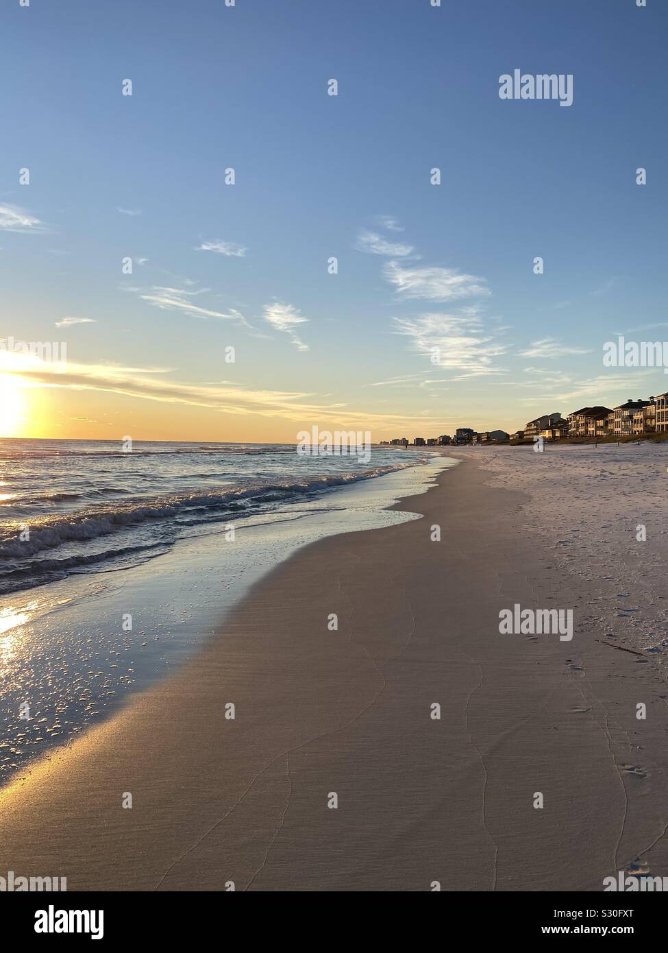 Sunset on Florida beach with colors reflecting on the sand - Smartphone Captured Stock Image