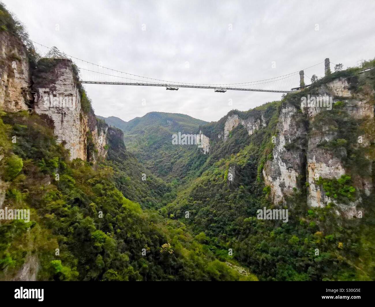 The Glass bridge over the Grand Canyon in Zhangjiajie, Hunan,China. - Smartphone Captured Stock Image