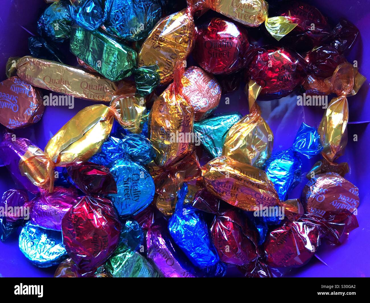 Chocolates In Colourful Wrappers Stock Photo - Alamy