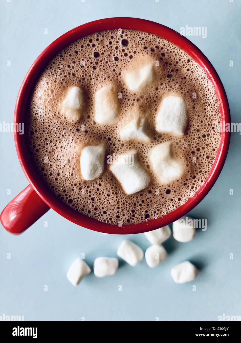 Top view of hot cocoa with marshmallows in a red mug Stock Photo