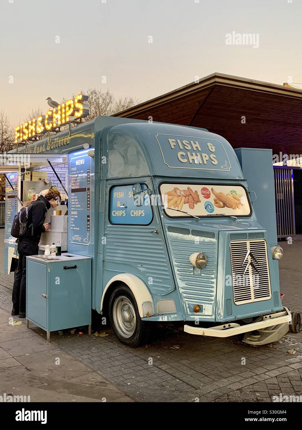 London, UK - 2 December 2019: Fish and chips sold from a pale blue vintage Citroen van. Southbank, Central London. Stock Photo