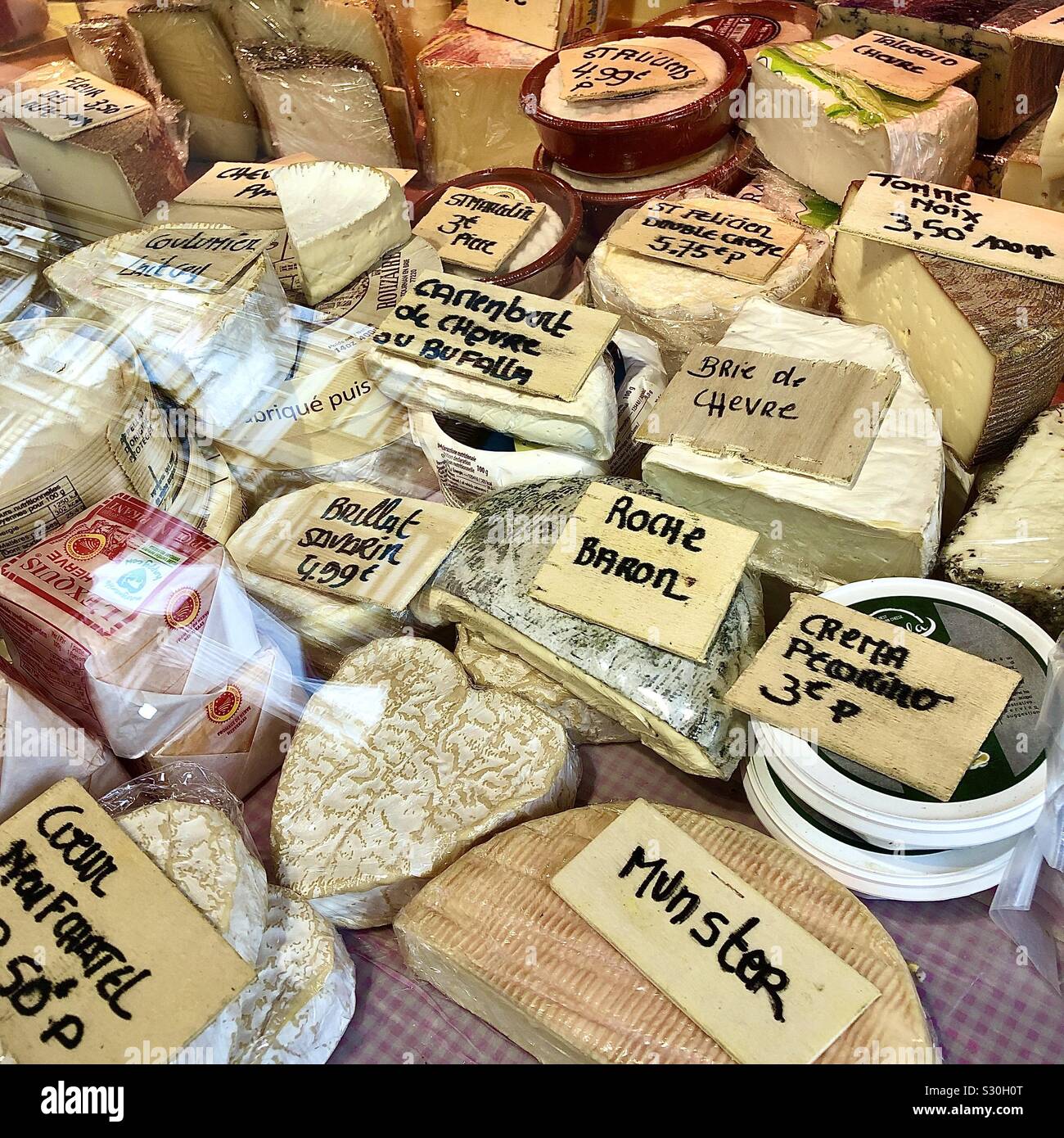 Variety of cheeses on market stall, Brussels, Belgium. - Smartphone Captured Stock Image