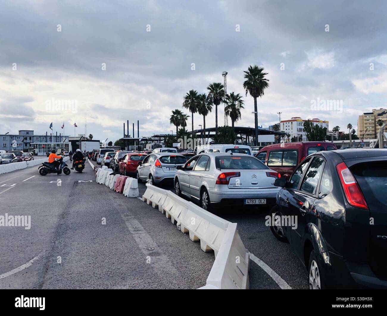 Cars queuing to cross the border from Gibraltar into Spain - Smartphone Captured Stock Image