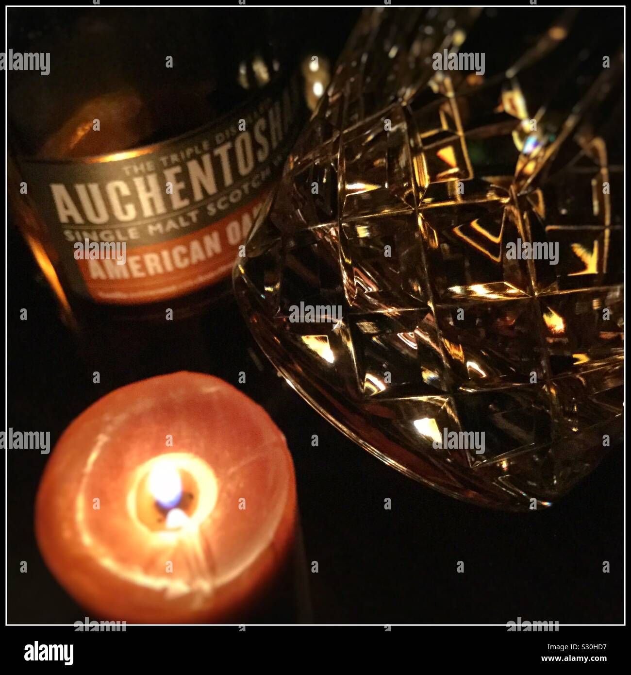 Auchentoshan American Oaked malt whisky, by candlelight. - Smartphone Captured Stock Image