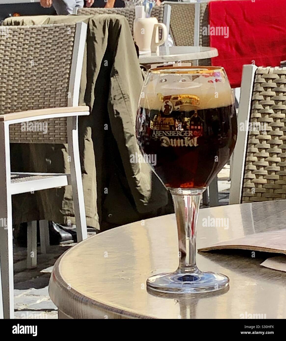 A glass of beer at an outdoor café in Regensburg, Germany, Bavaria. - Smartphone Captured Stock Image