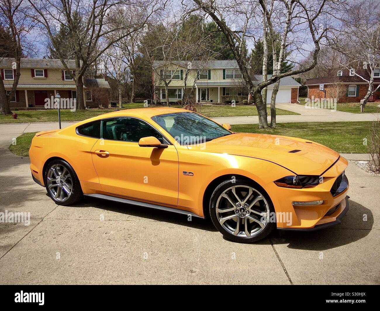 New 5 liter Ford Mustang sports car in driveway, Detroit, Michigan, USA. - Smartphone Captured Stock Image