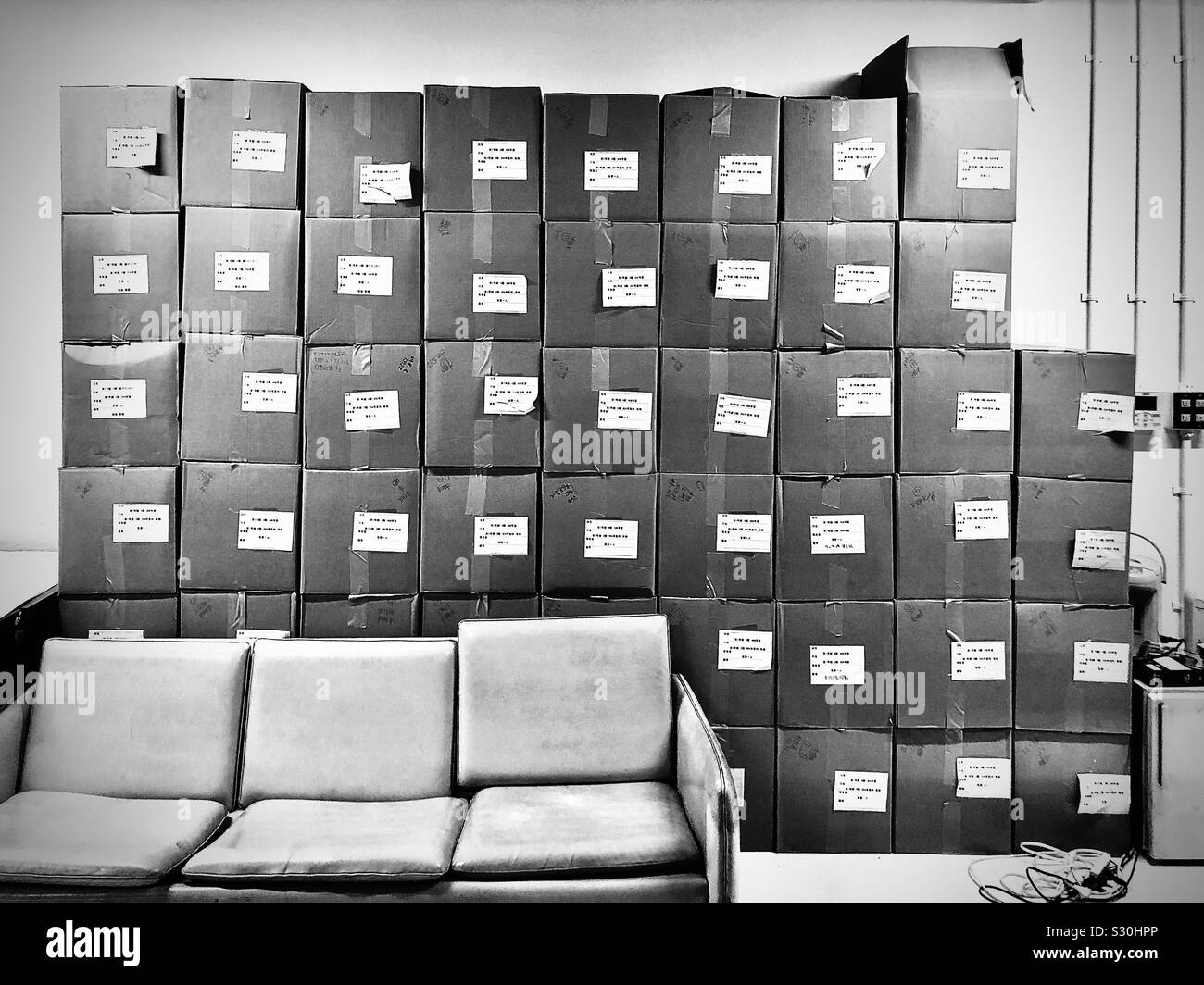 Cardboard boxes piled up for moving - Smartphone Captured Stock Image