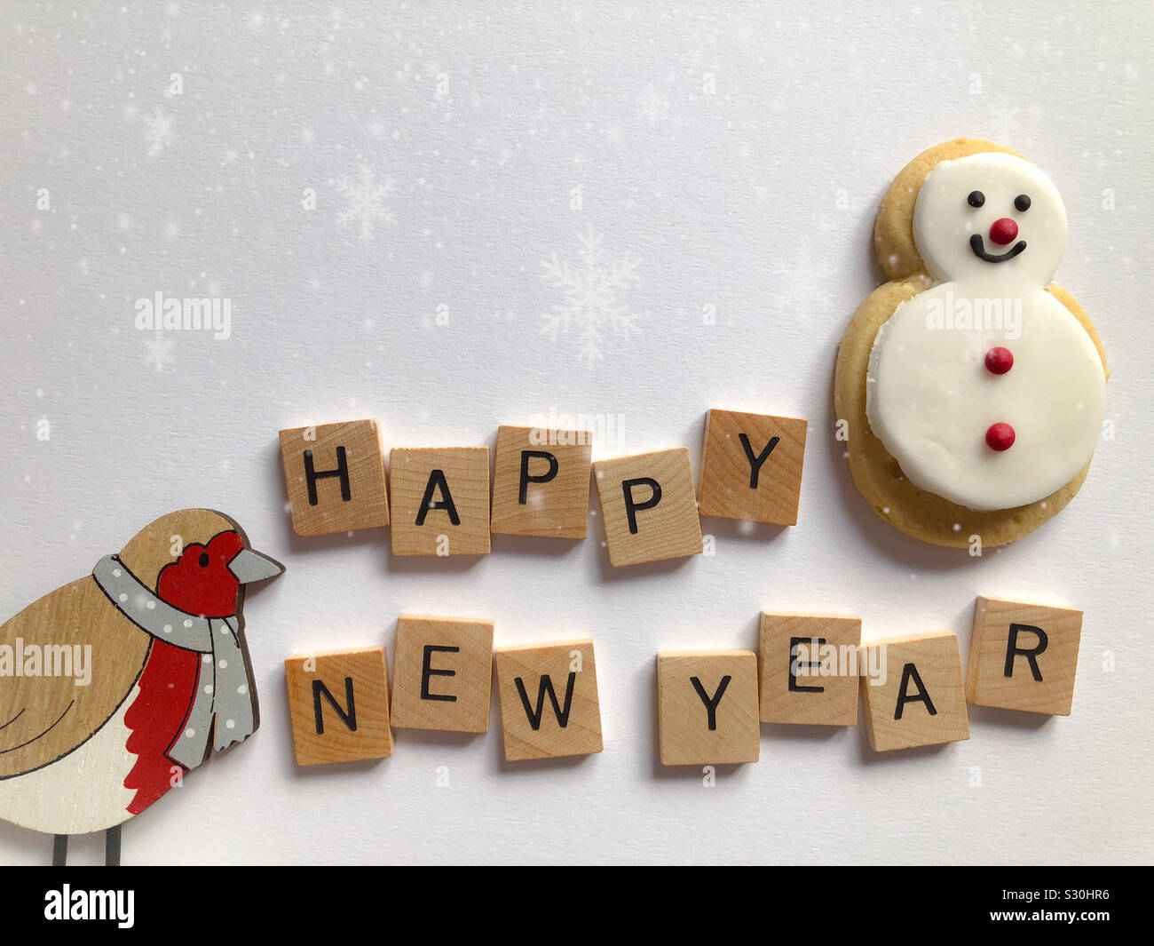 Happy New Year, gingerbread snowman and robin Stock Photo
