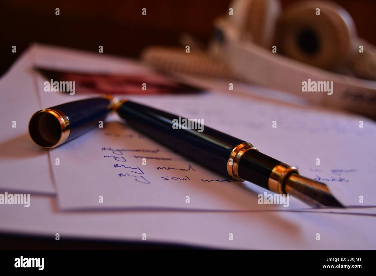 An old fashioned fountain pen alongside some writing Stock Photo - Alamy