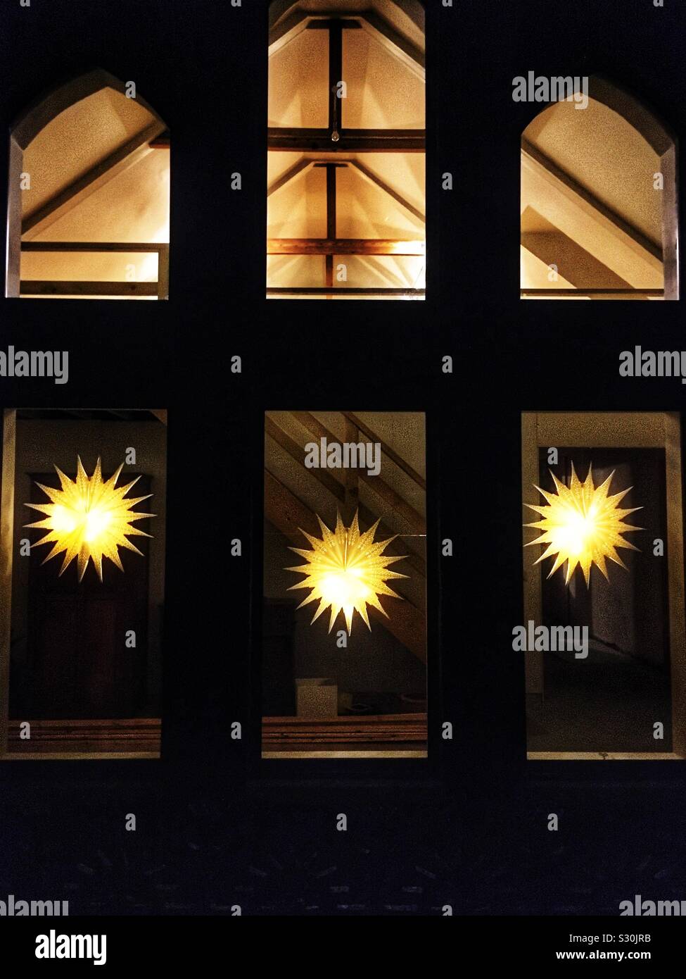 Christmas decorative lighting in a former chapel now residential property - Smartphone Captured Stock Image