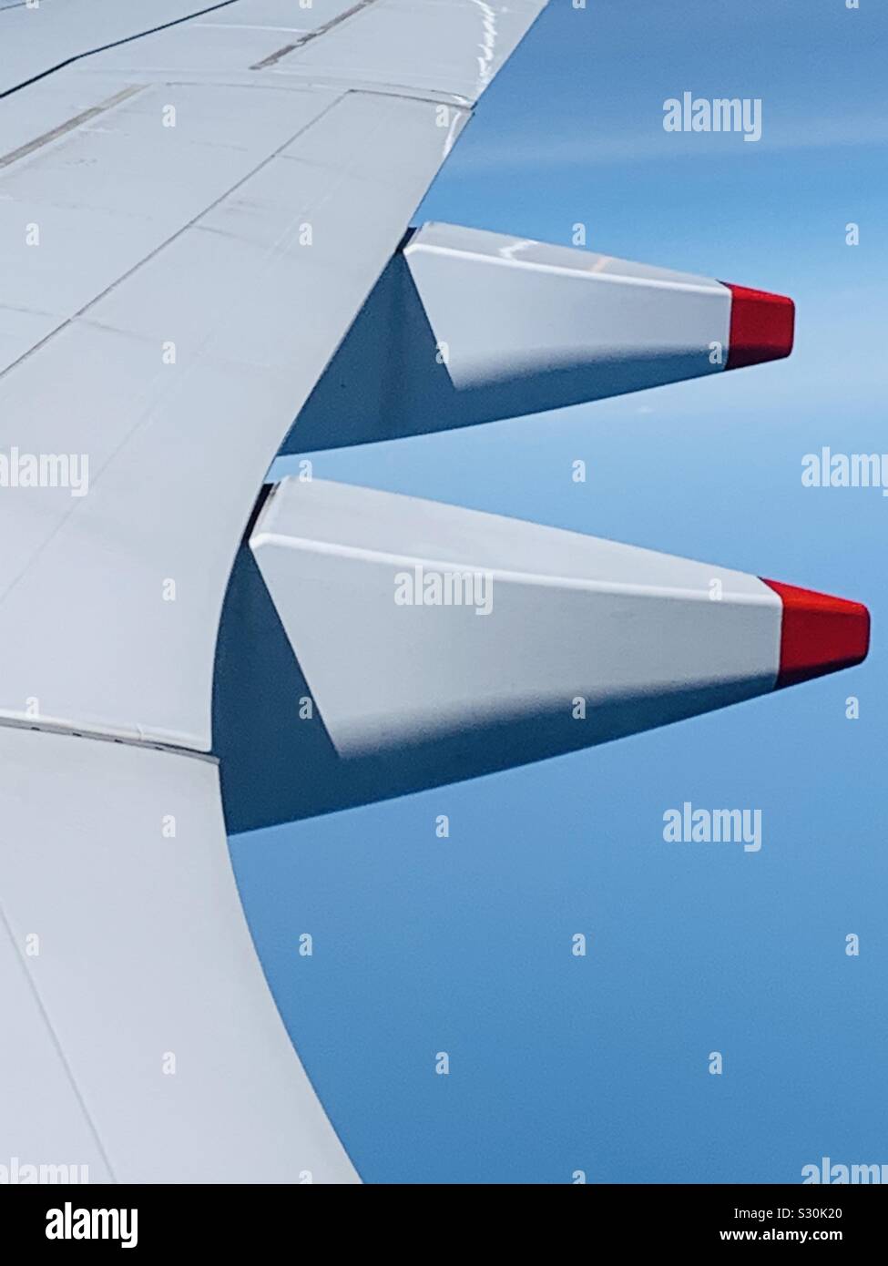 Part of airplane wing against the sky. - Smartphone Captured Stock Image