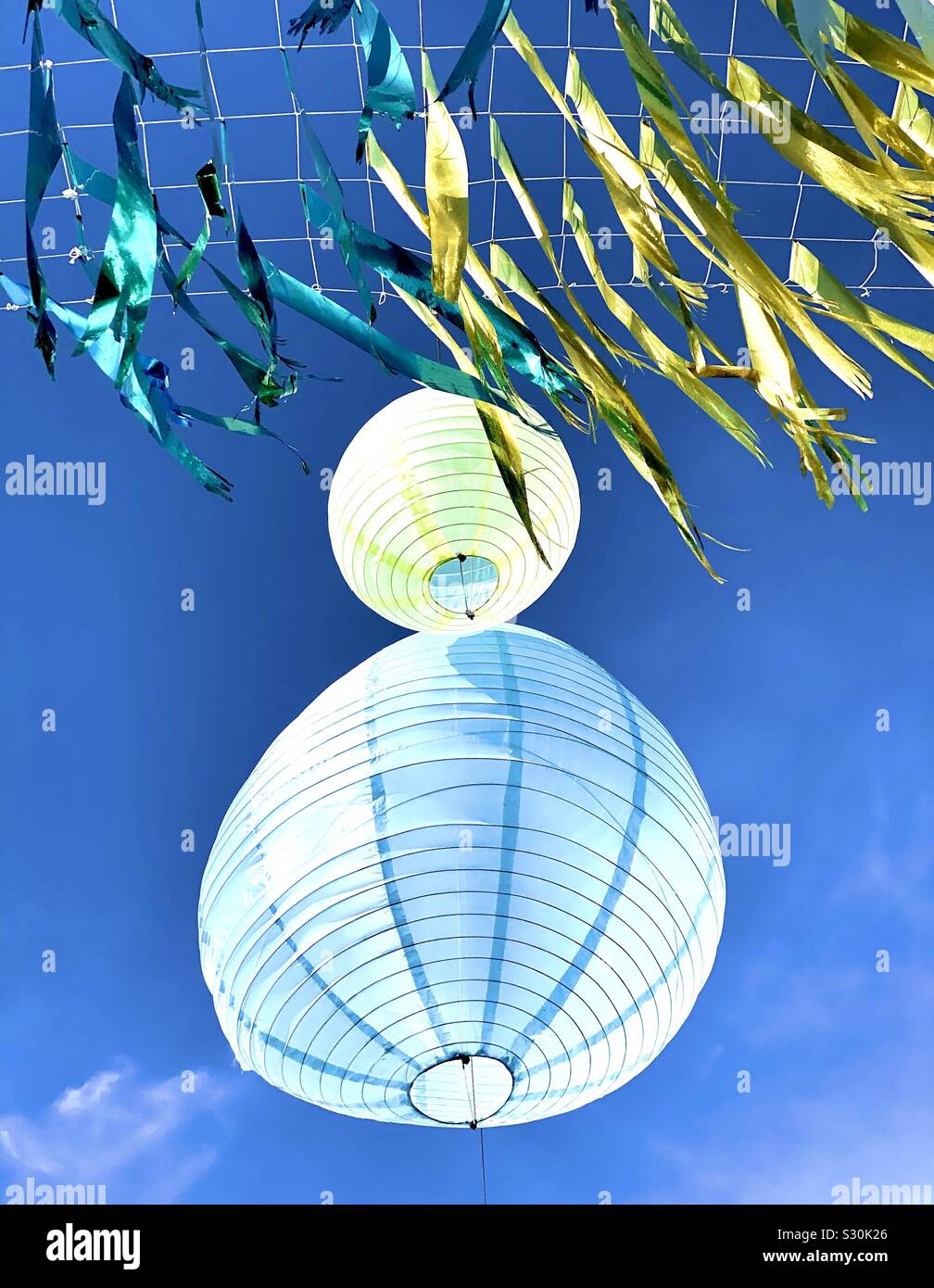 Paper lanterns and foil ribbons Stock Photo Alamy
