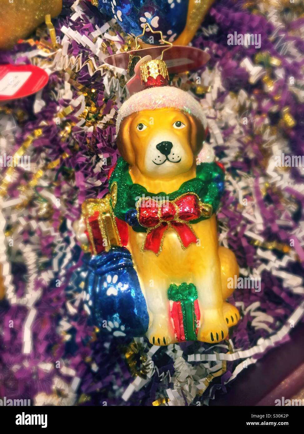 Festive holiday dog Christmas tree ornament for sale Stock Photo
