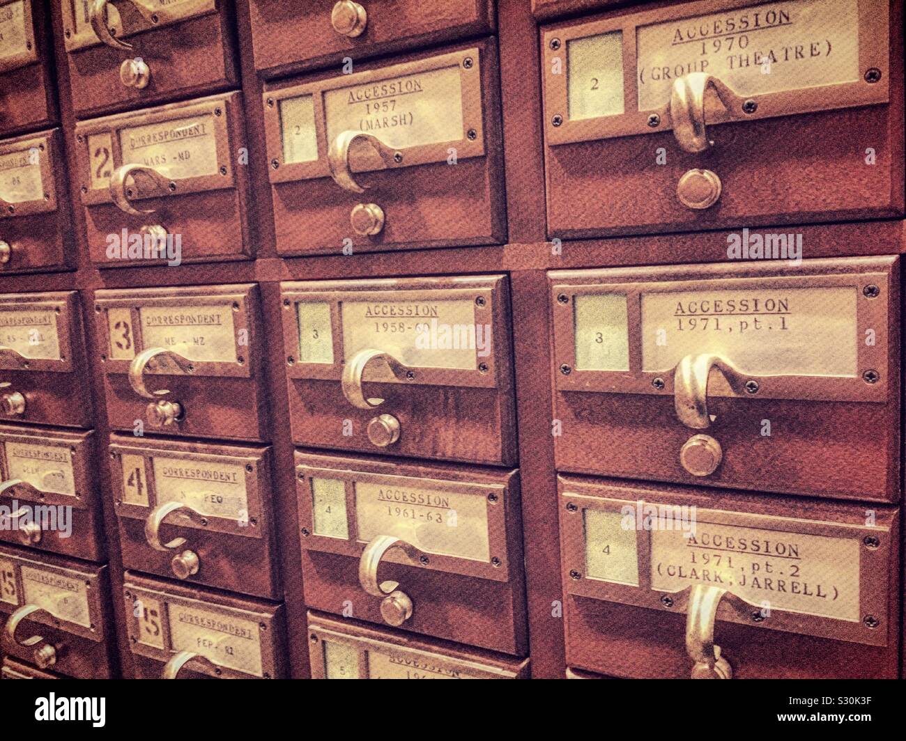 Vintage card catalog drawers at a public library, USA - Smartphone Captured Stock Image