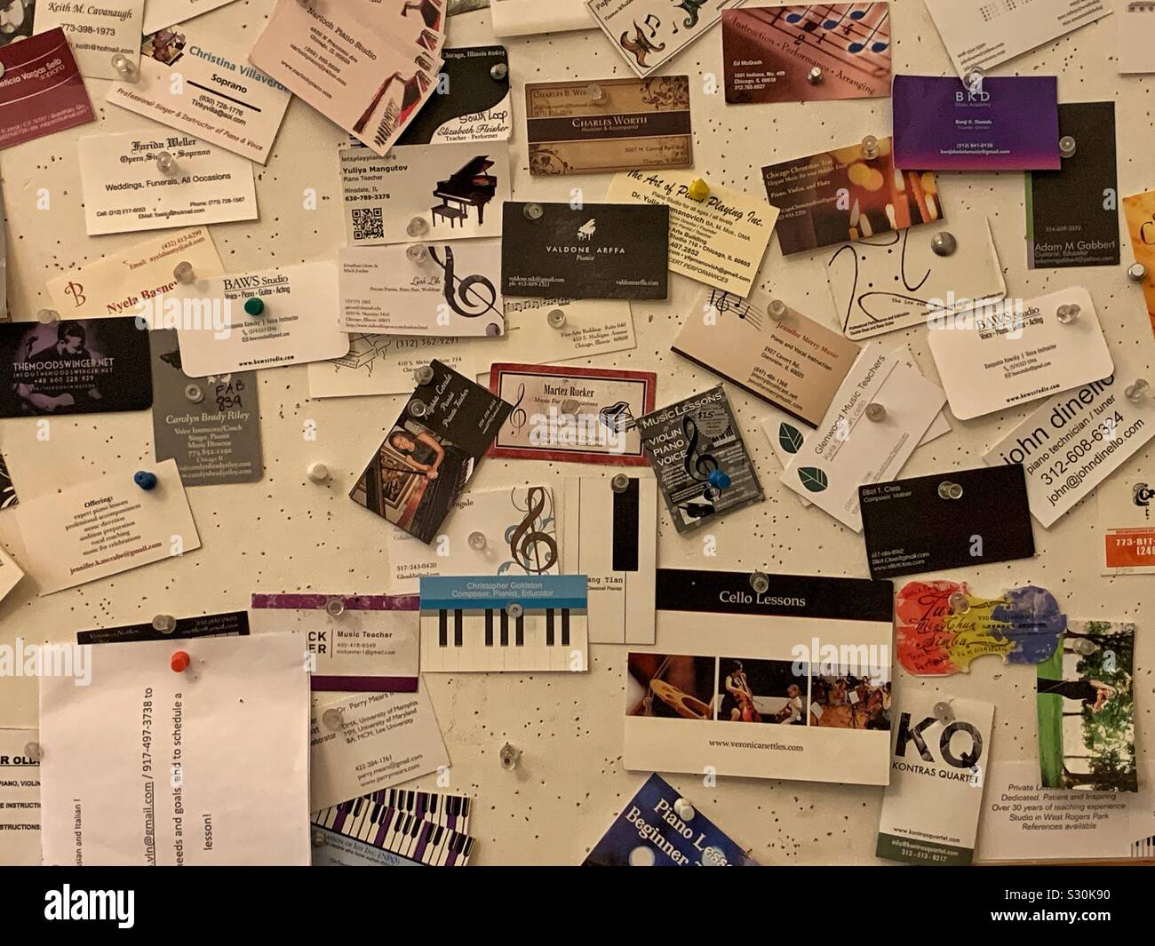 Scores of business cards posted by classical musicians offering their services Stock Photo